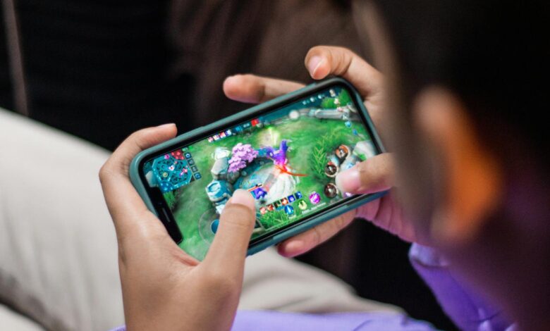 a person is playing a video game on their phone